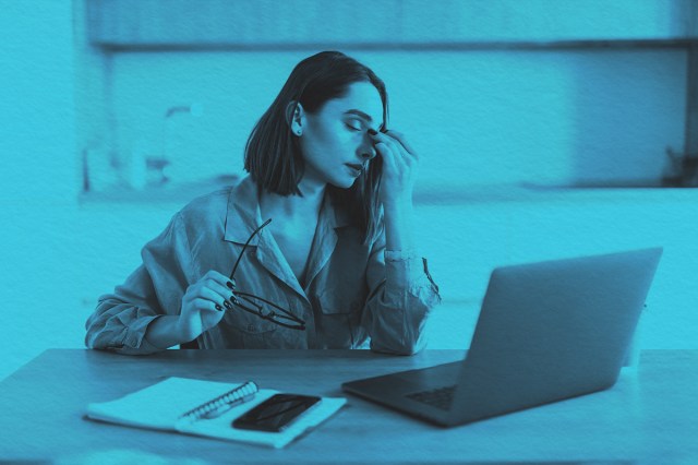 Upset woman working from home office