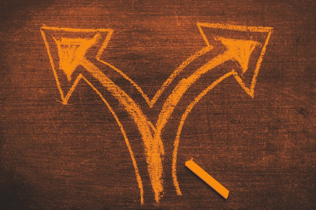 Two direction arrows on chalkboard