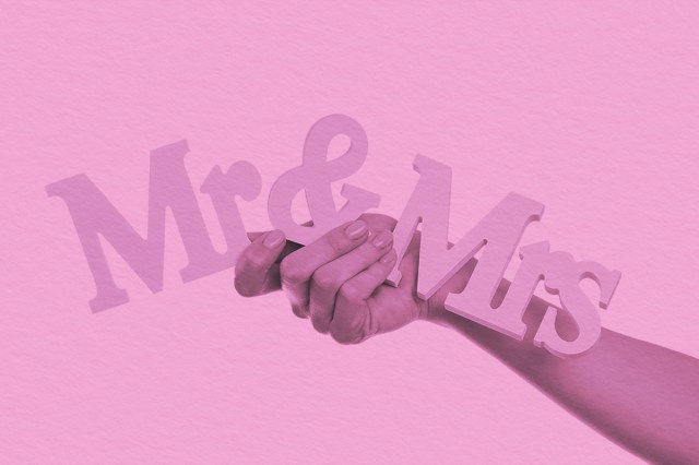 hands holding letters Mr and Mrs