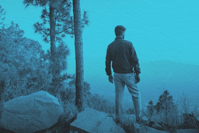 Young man looks at the nature view