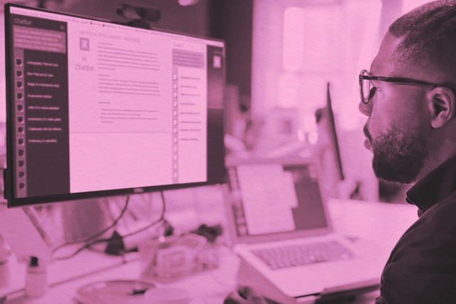 Man looking at AI chat on computer