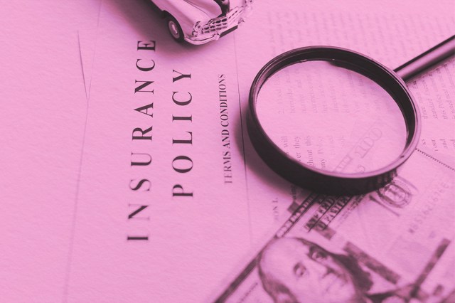 Certificate of motor insurance and policy with car and dollar bills