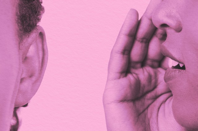 Close-up of whispering in someone's ear