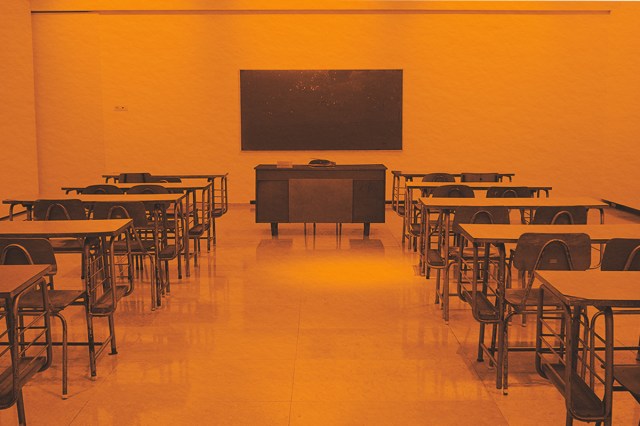 Chalkboard and chairs inside a classroom