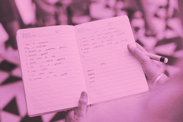 Close-up of notebook with writing inside